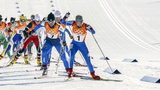 Cross-country skiers compete in the Olympic Games.